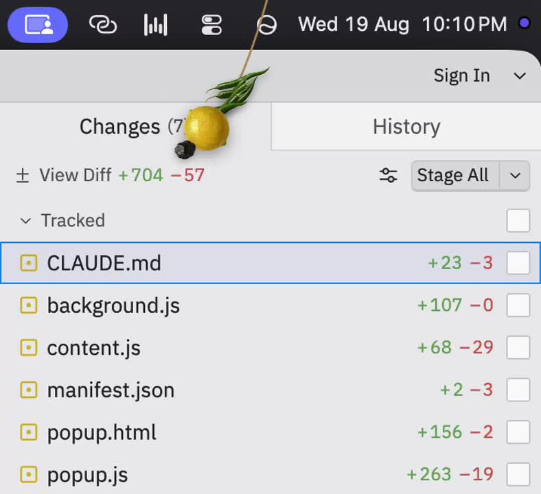 Lucky Dangle desktop charm hanging a nimbu mirchi on a pull request